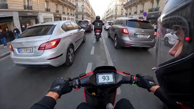 Race car POV camera mounted on a delivery e-bike, weaving through rush hour tra…